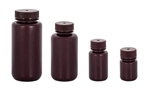 Set of four brown bottles with caps on a white background
